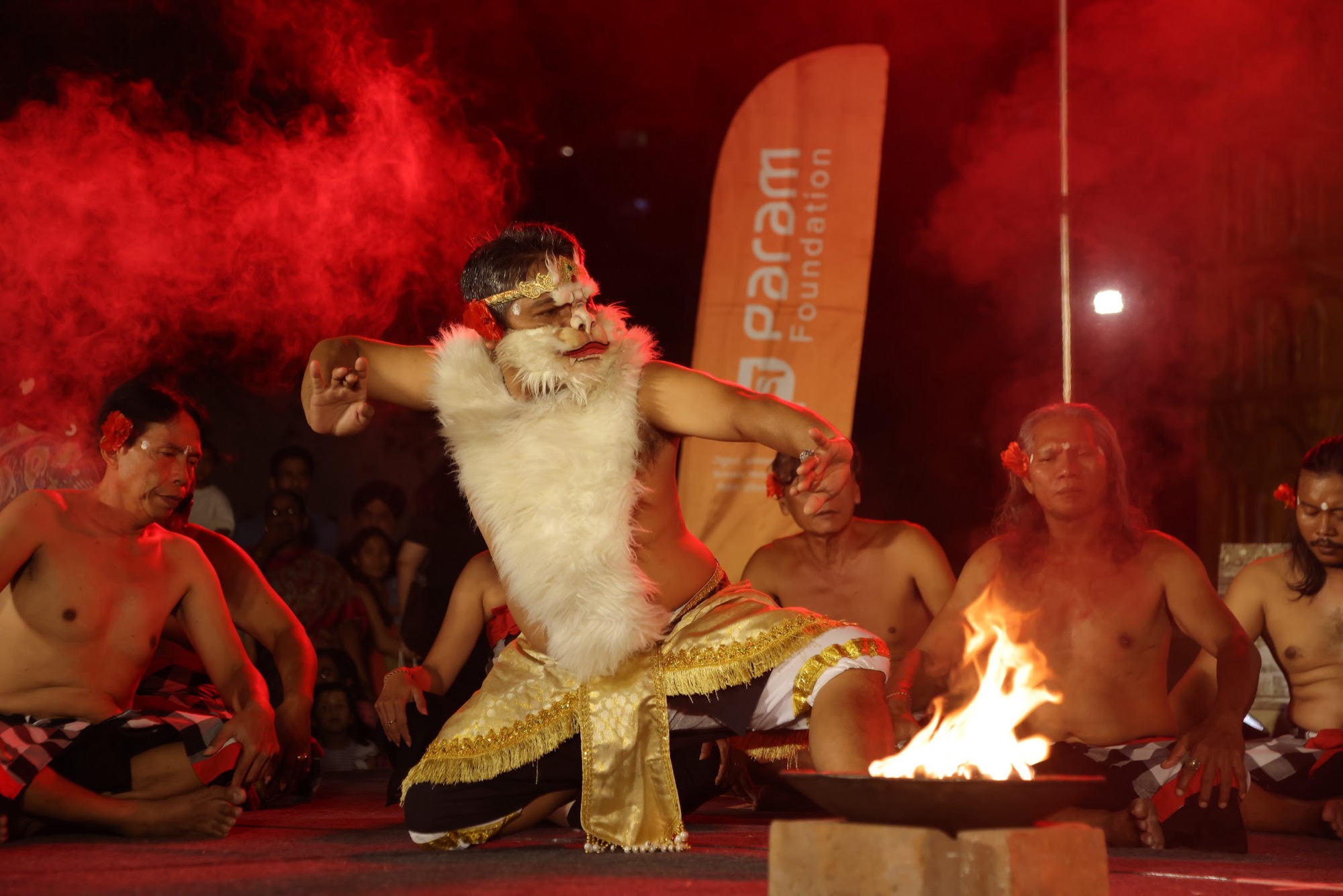 A Kecak dancer leaps beside the fire at the festival's opening night, Orion Mall