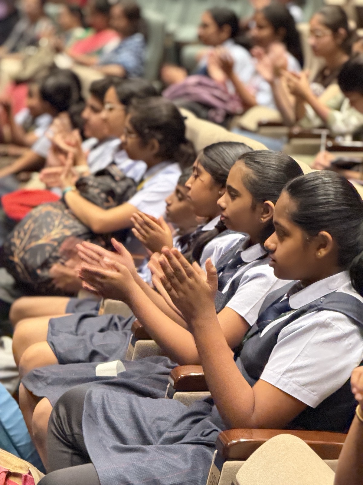 Students clapping along at a Balinese arts workshop