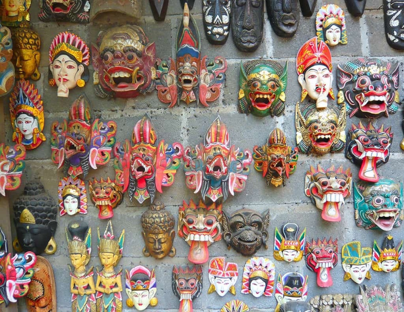 A wall of colourful Balinese masks